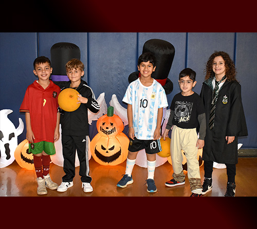 Students in the Spooky Gym for Halloween