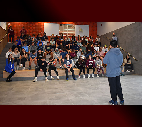 Students and Principal sitting at a table