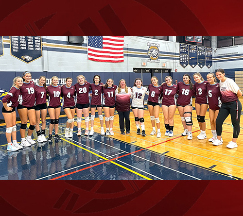 HS Volleyball Varsity Players with their coach