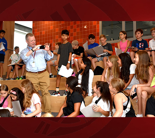 Students and Principal sitting at a table