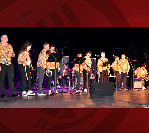 Students playing music on stage