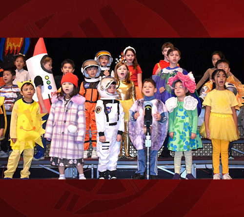Students at the stage performing