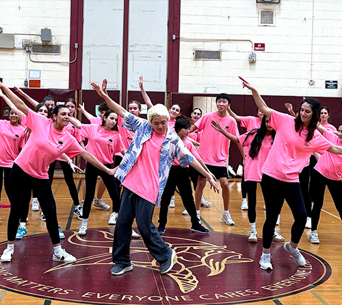 students wearing pink posing