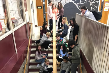 children building a ramp on a staircase