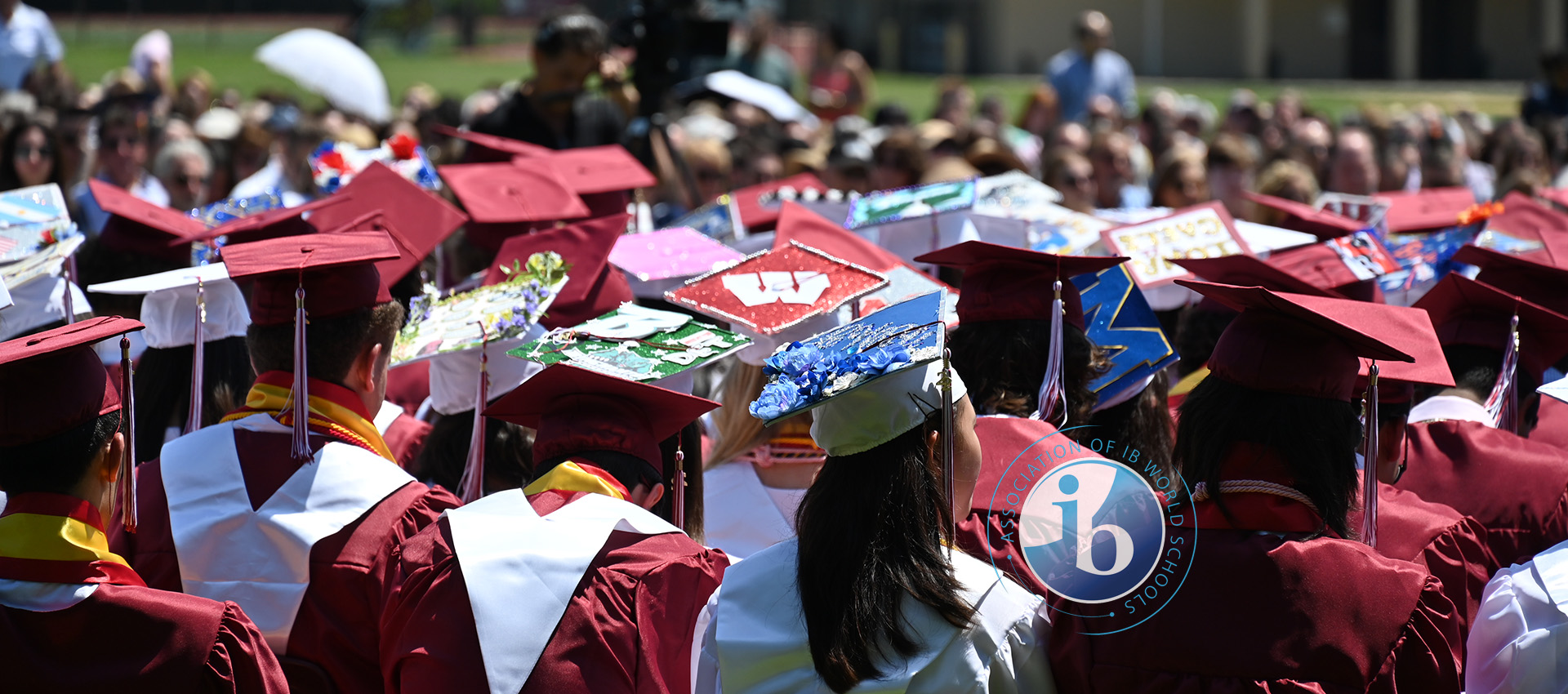Students sitting wearing maroon